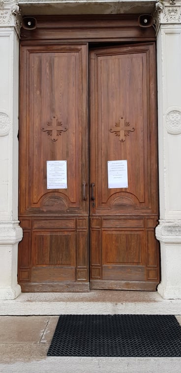 On the door of a church in Northern Italy, a notice inform parishioners of the cancellation of all liturgies and invite them to follow the Ash Wednesday Mass and the Sunday Mass on the local radio