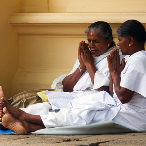 Women praying near the Temple of the Toorh, Kandy