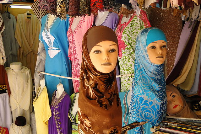 Fashion display of hijabs and other garments at a shop in Tangier