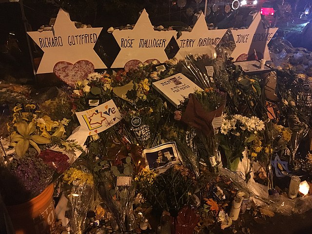 Flowers and prayer cards remembers the victims of the shootings at the Tree of Life synagogue.